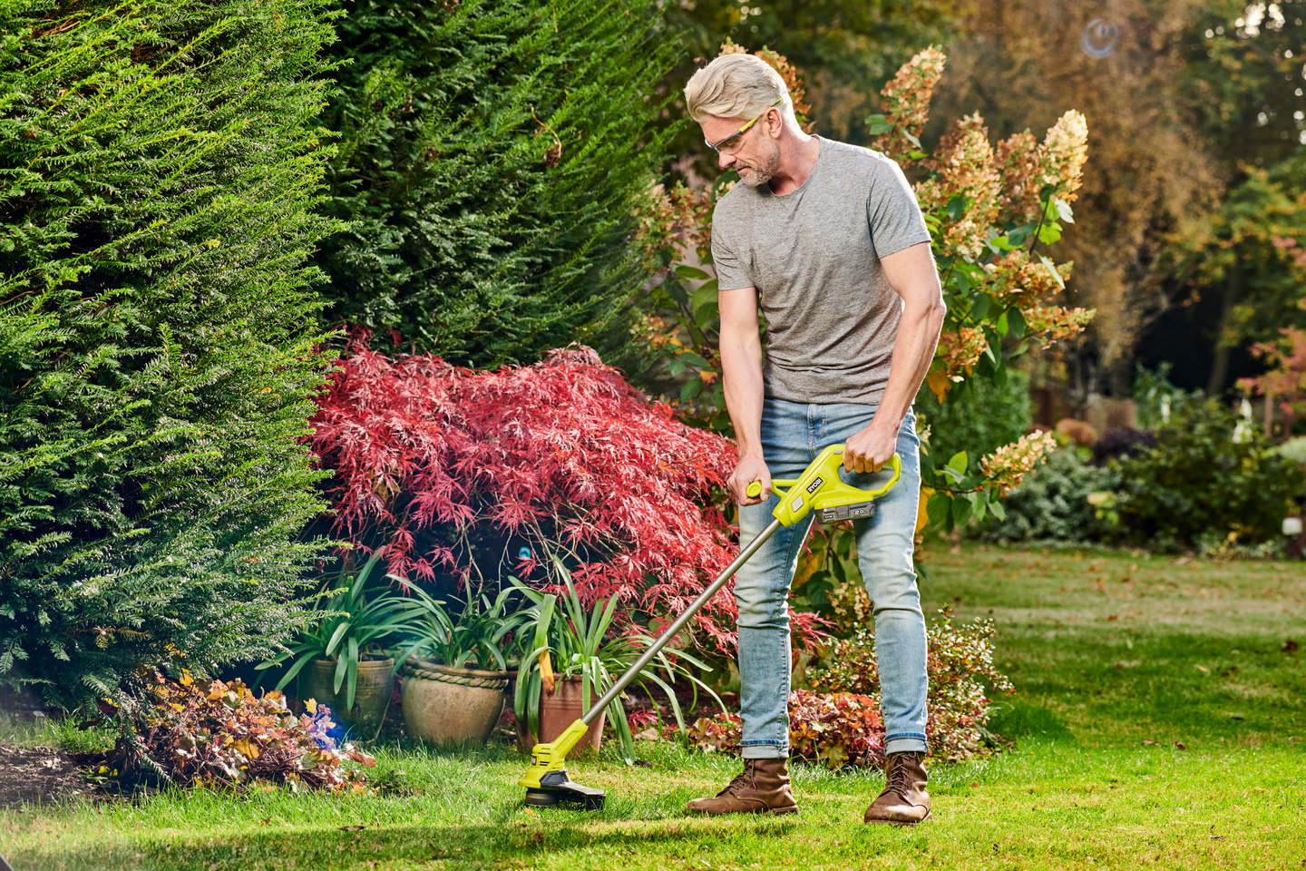 Akkutrimmeri Ryobi RY18LT23A-120P 18V ONE+ 1x2,0Ah + 10 terää