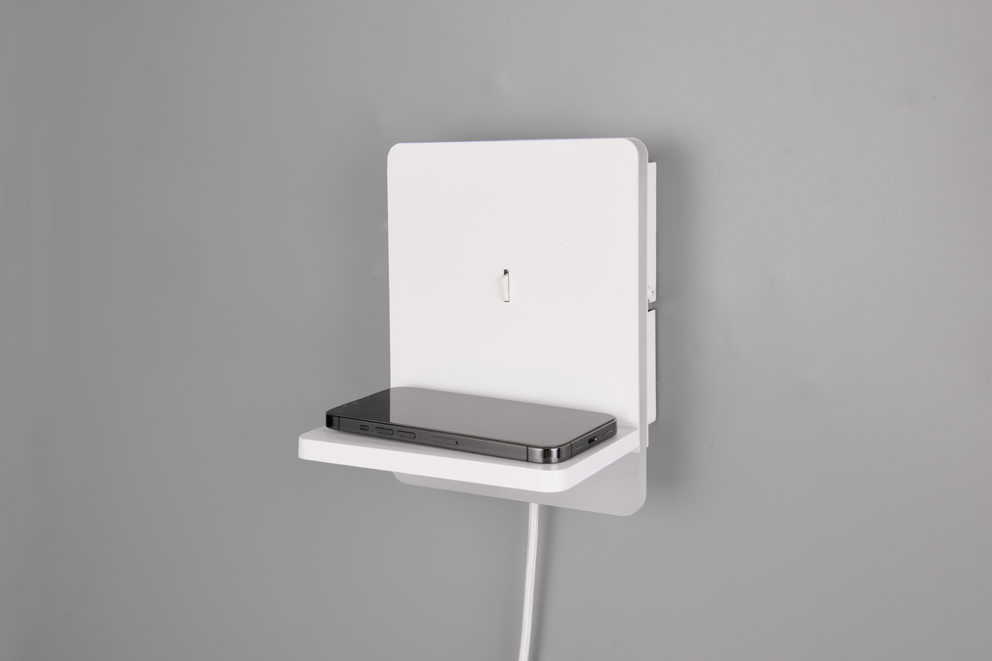 Seinävalaisin TRIO Fairfield led mattavalkoinen induktiivisellä latausasemalla