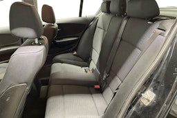 musta BMW 116 2010 kuva 10.