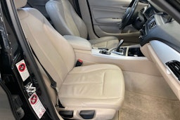 musta BMW 116 2011 kuva 12.