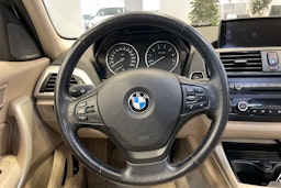 musta BMW 116 2011 kuva 14.