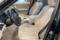 musta BMW 116 2011 kuva 15.