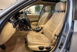 sininen BMW 320 2010 kuva 8.
