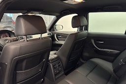 musta BMW 330 2009 kuva 14.