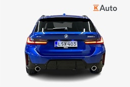 sininen BMW 330 2023 kuva 3.