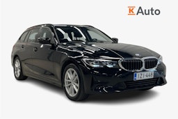 Musta BMW 330e 2021 kuva 1.