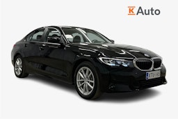 Musta BMW 330e 2021 kuva 1.