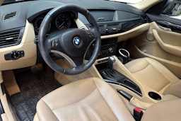 musta BMW X1 2009 kuva 7.