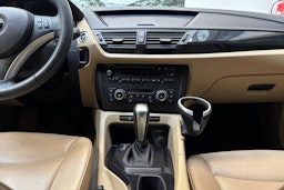 musta BMW X1 2009 kuva 16.