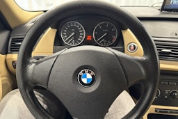 musta BMW X1 2010 kuva 14.