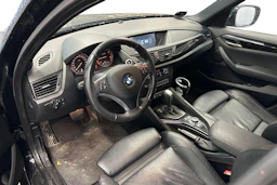 musta BMW X1 2010 kuva 3.