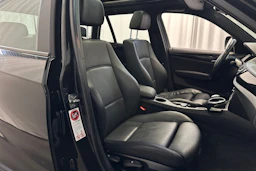 musta BMW X1 2010 kuva 11.