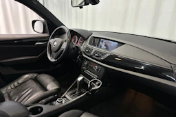 musta BMW X1 2010 kuva 12.