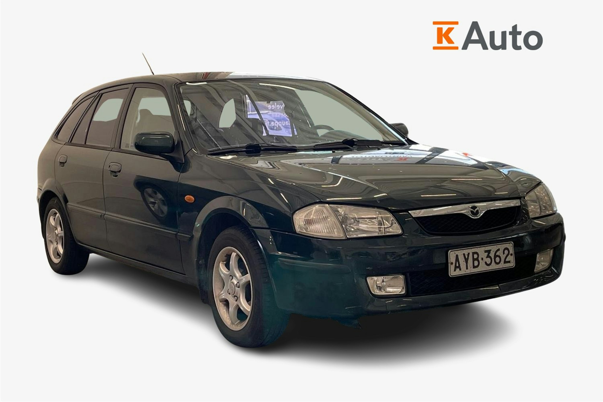 vihreä Mazda 323 1999 kuva 1.