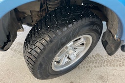 Sininen Mitsubishi L200 2011 kuva 13.