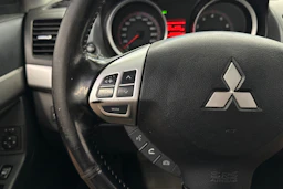 punainen Mitsubishi Lancer 2008 kuva 13.