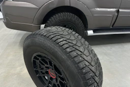 Ruskea (beige) Mitsubishi Pajero 2011 kuva 34.