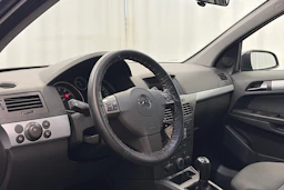 sininen Opel Astra 2006 kuva 13.