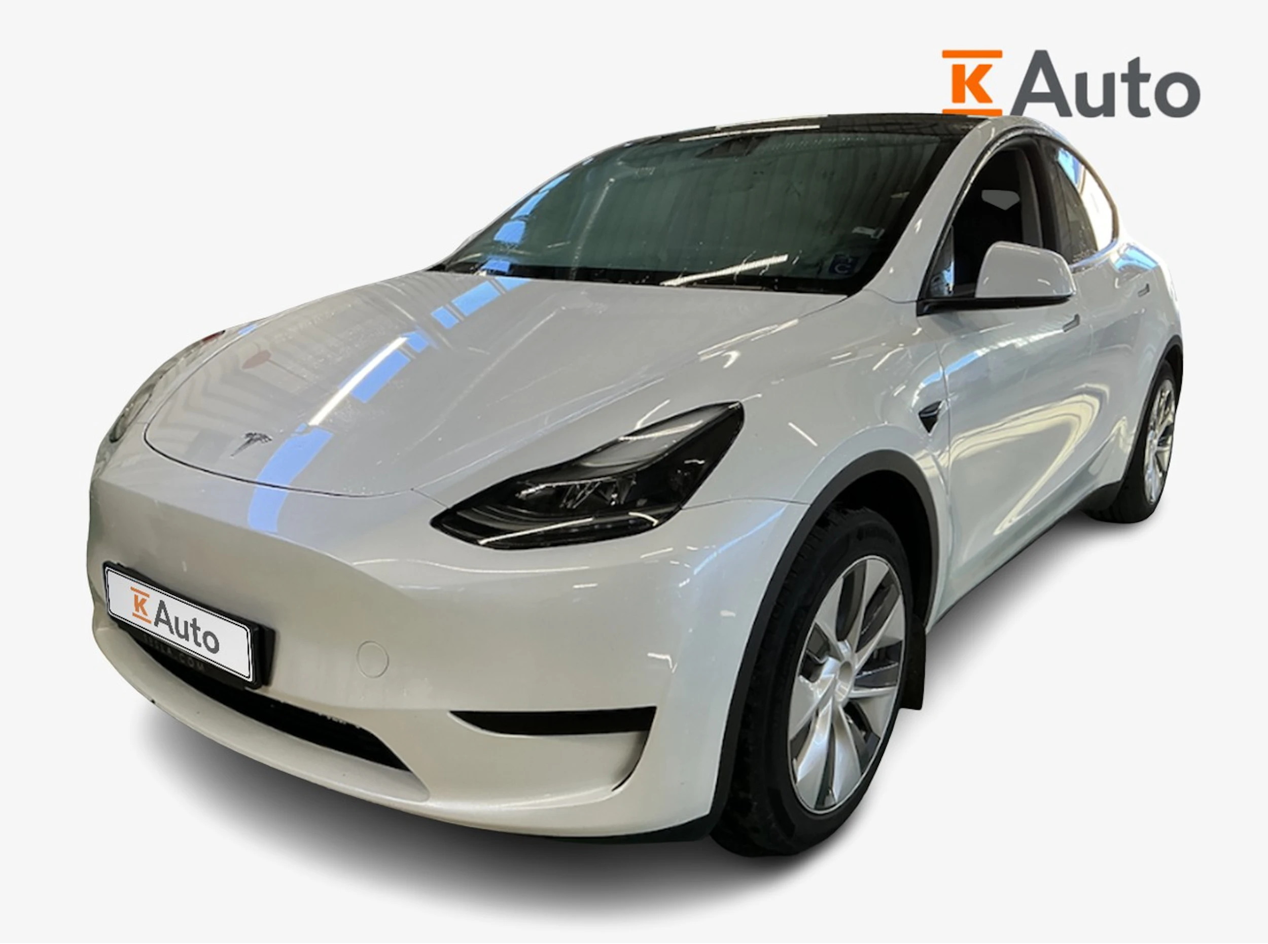 valkoinen Tesla Model Y 2024 kuva 1.