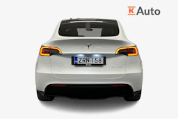 valkoinen Tesla Model Y 2024 kuva 4.