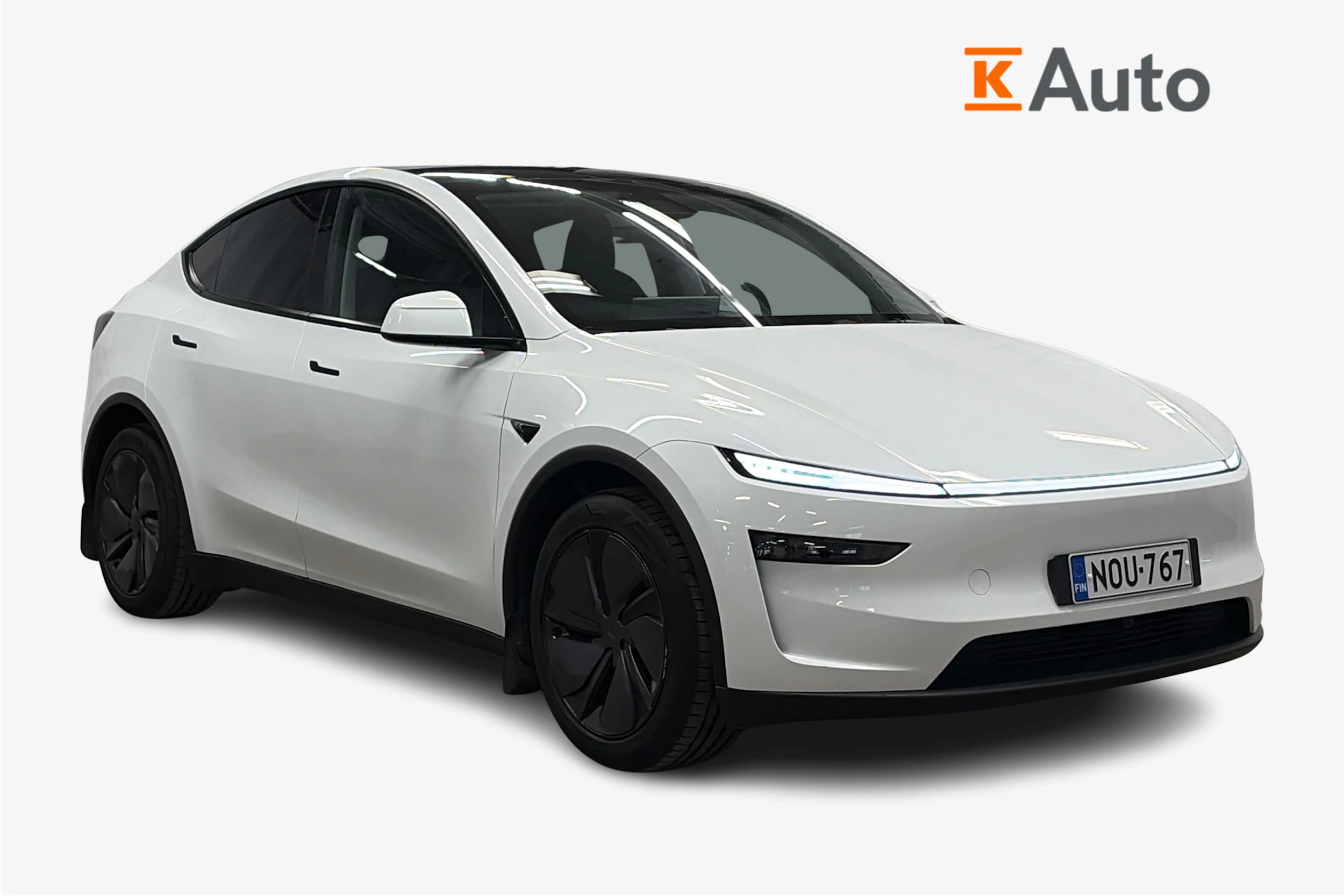 valkoinen Tesla Model Y 2025 kuva 1.