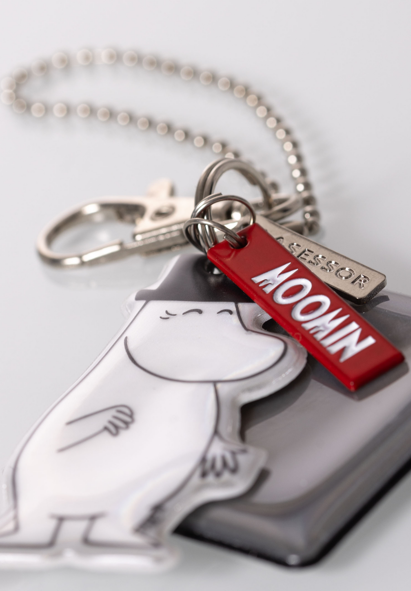 Lasessor X Moomin Design koruheijastin Muumipappa neliöllä